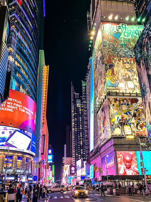 Immersive view of Times Square's nightlife with vibrant billboards and bustling traffic.